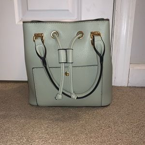 Light green, small purse. Barely used.